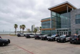 Corpus Christi Police vehicles stationed outside department headquarters on an overcast day