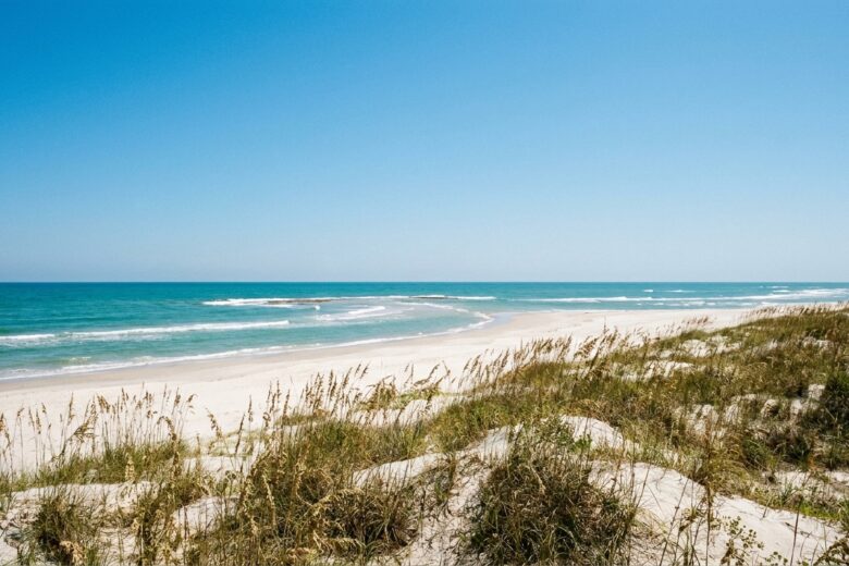 Clear turquoise Gulf waters and white sand beach at Port Aransas, Texas