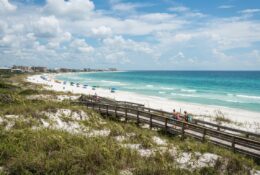 Emerald Coast beach boardwalk leading to turquoise waters and white sand