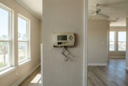 Interior of coastal Texas rental home showing broken air conditioning system during summer heat