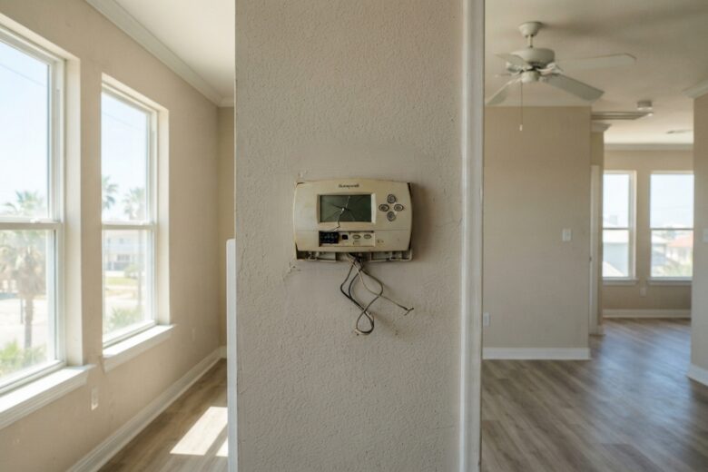 Interior of coastal Texas rental home showing broken air conditioning system during summer heat