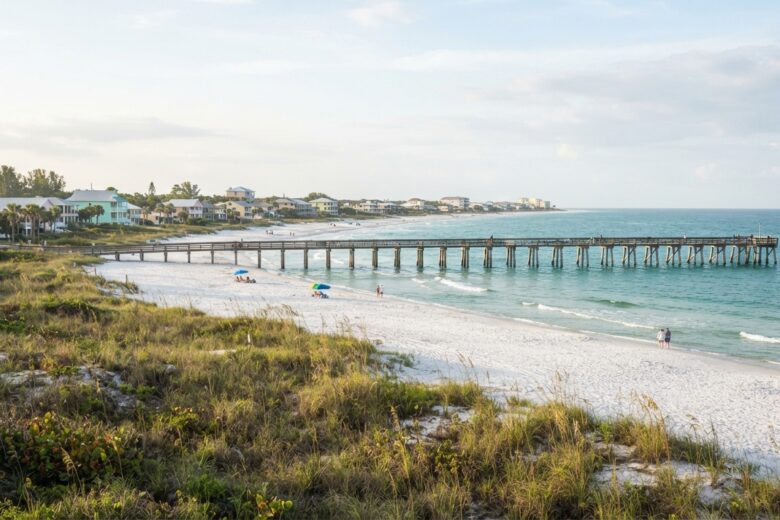 Quiet Alabama Gulf Coast beach town with white sand, fishing pier, and uncrowded shoreline